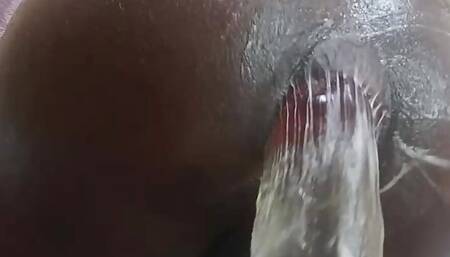 Oiled ass riding massive clear dildo