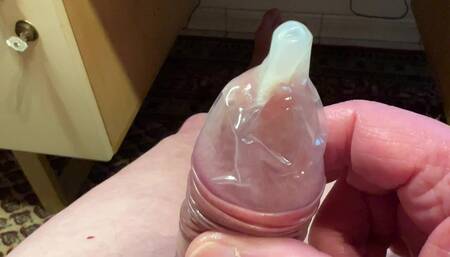 Wank with a condom and cum