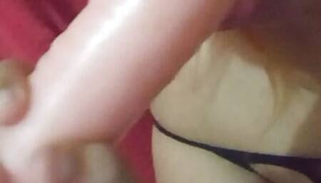 Very slutty young man enjoys sucking his dildo as if it were a penis