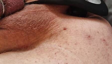 Enjoying an anal vibrator and chastity cage