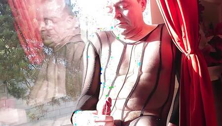 Crossdresser masturbates in a publick window dressed in sexy lingerie