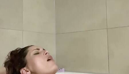 She is playing in her bath