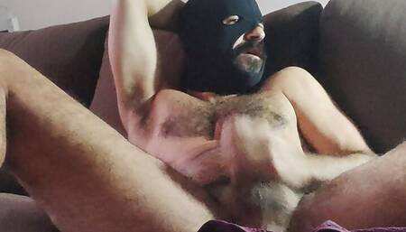 Masked daddy put his legs up and jerk off watching porn