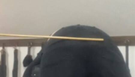 A caning over trousers, pants then the bare