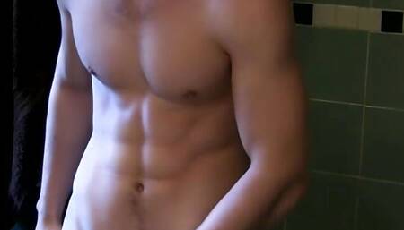 Zack Randall tugs his massive hairy dick and cums on mirror