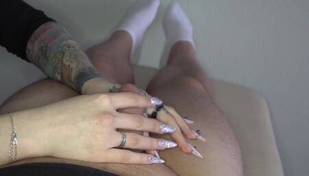 Long nails scratching small soft cock