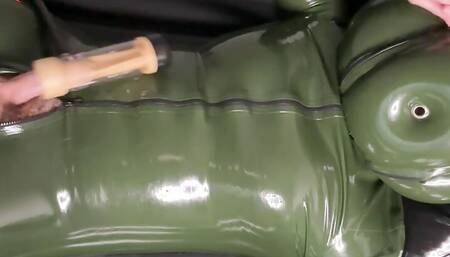 Hairy Guy in Green Rubber Suit & Inflatable Hood Milked by Venus