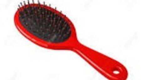 Masturbating with a hairbrush