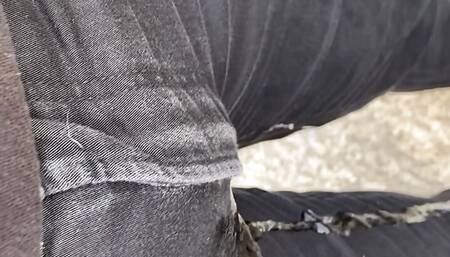 Pissing my black jeans outside
