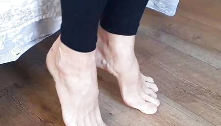 Beautiful mature legs posing and feet worship