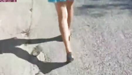 Mel walking on the side of the road