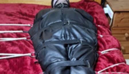 Handjob on a man in sleepsack by woman 1-BBW domination,BBW bondage,man in bondage,male bondage,man tied up,leather sleepsack,sleep sack,amateur, bound and gagged man,bed bound,handjob,cock and balls tied,edging,edged,