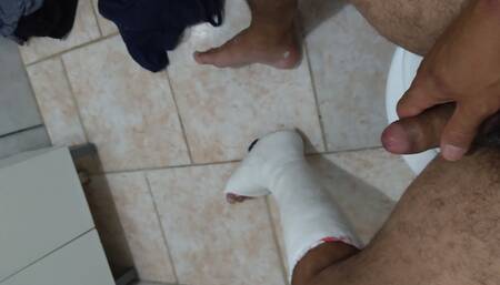 With foot in plaster, dick out
