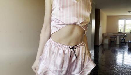 Early summer morning in the kitchen in delicate pajamas