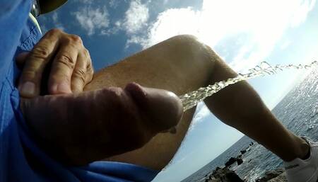 Pissing and cum in the beach