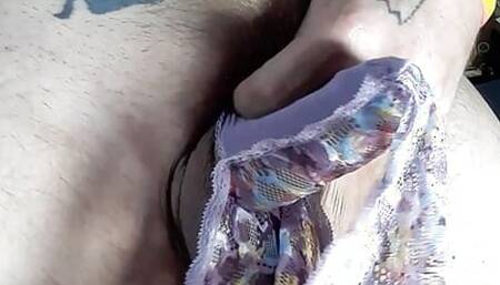 Panty boy plays with his floral lace panties while watching a goon video and licks his cum up