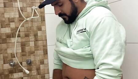 Bearded in the bathroom playing with his Big Cock until he cums and spreads sperm