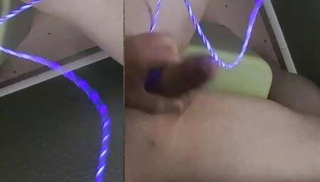 inserting phone light charger cable into dick