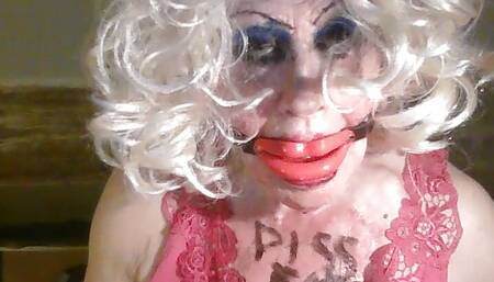 Sissy cd whore, Sarah, humiliates herself, by drinking own piss, while mouth gagged