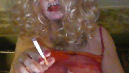 Crossdresser, smokes, fucks  herself with fake black cock, wanks