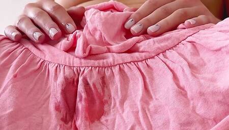 Her wet pussy sticks to the skirt! Girl is masturbating through the skirt until gets orgasm.