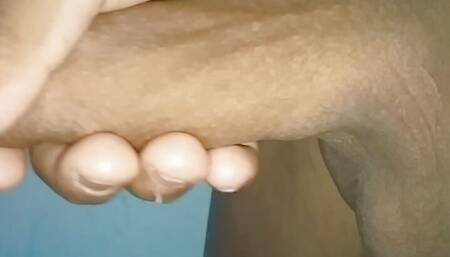 Masturbating until he releases semen