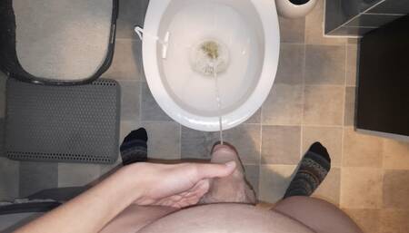 Young Twink jerks and piss in the toilet