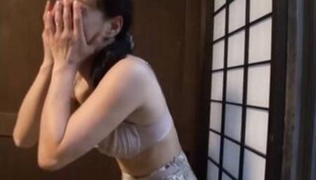 Pretty Japanese cougar striptease inside front of audience