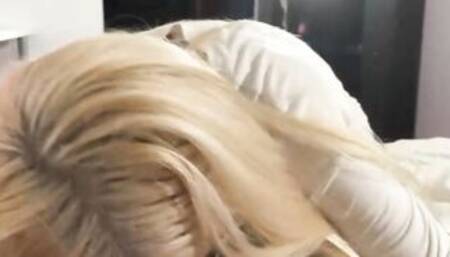 Blonde bombshell is on her knees and giving a fellatio