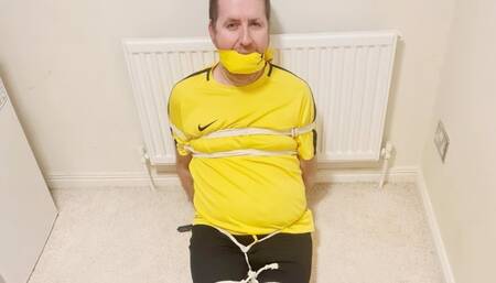 Preview of footballer tied up for over 7 hours 2 -BBW domination, BBW bondage,bound and gagged man,man tied up,amateur,male bondage,man in bondage,soccer kit,football kit,socks,rope bondage,gay bondage,