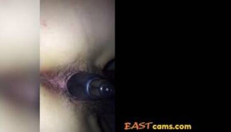 Hairy Japanese girl with a toy in her pussy