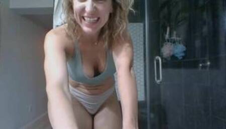 Classy MILF showers and applies lotion to her toned body