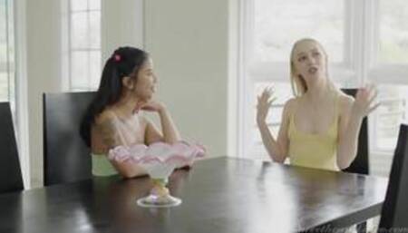 Braylin Bailey and Ameana Green on a white coloured bed in a lesbian scene together