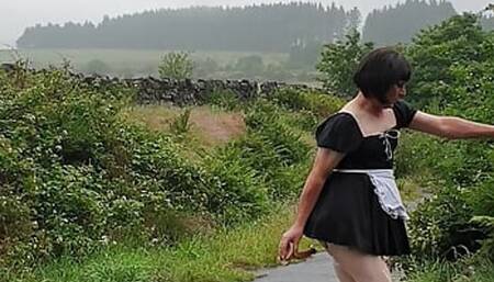 Crossdressing slut Maid on a public lane in the rain