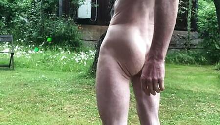 Naked and masturbating in the garden