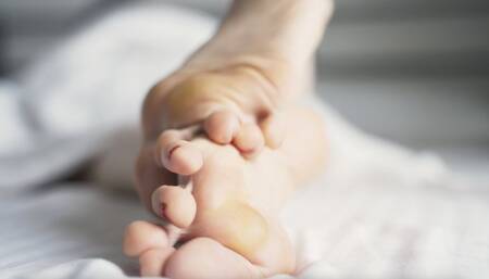 Callused feet relax in bed (1080p)