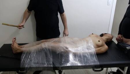 Flavia blowjob wrapped in plastic, with bastinado and tit spanking (PART 03)