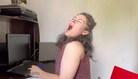 sits at the workplace and yawns mpg