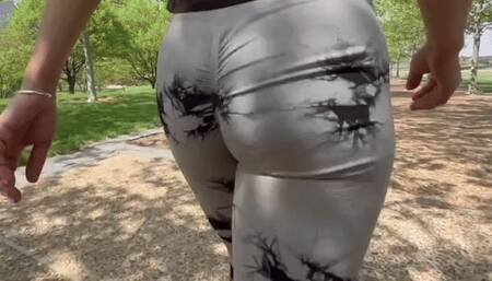 Spandex wearing teen girl walks through the park