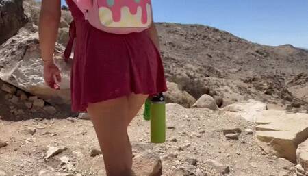 Teenage girl hiking up skirt