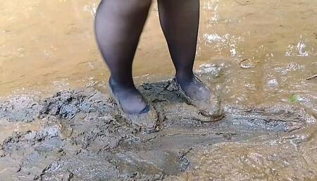 Girl in ballet flats slips hard on muddy surface