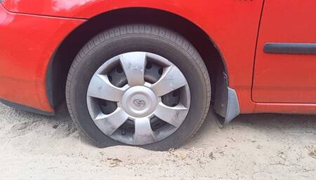 Spinning wheels in sand