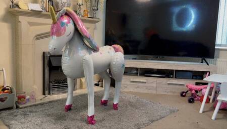 Foil unicorn balloon sit popping