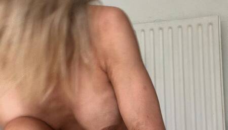 putting on thick neoprene wetsuit with hood gloves and socks and snorkel mask