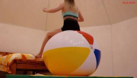 Alla bounces high on a big beach ball and a big fitness ball!!!