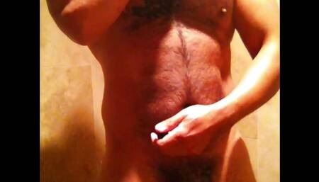 Hairy latin muscle wanks in shower with cum shot
