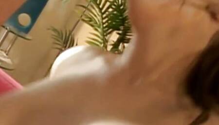 Stunning dark haired MILF loves handling two loaded cocks at the same time