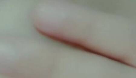 Curvy horny girl sucks her own nipples while masturbating
