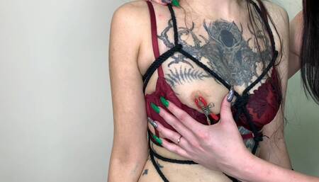 Lesbian femdom. Dominatrix Nika handcuffed the girl, made a beautiful tie with ropes on her body, played with the slave's nipple