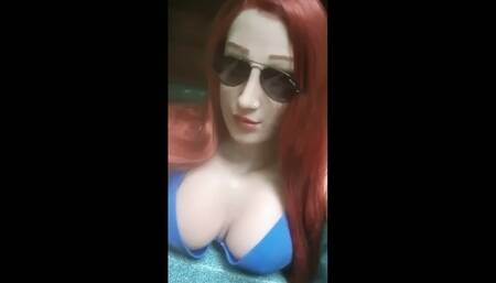 Female masking topless in a Jacuzzi
